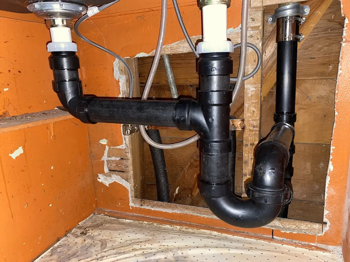 Professional Garbage Disposal Repair equipment and tools on the job in Underhill
